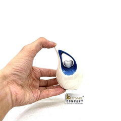 Pearl White Teardrop Mini Cremation Urn with Blue Neck and White Heart - Small Urn - Mini Urns Human Ashes - Urn for Ash from Keepsake Co.