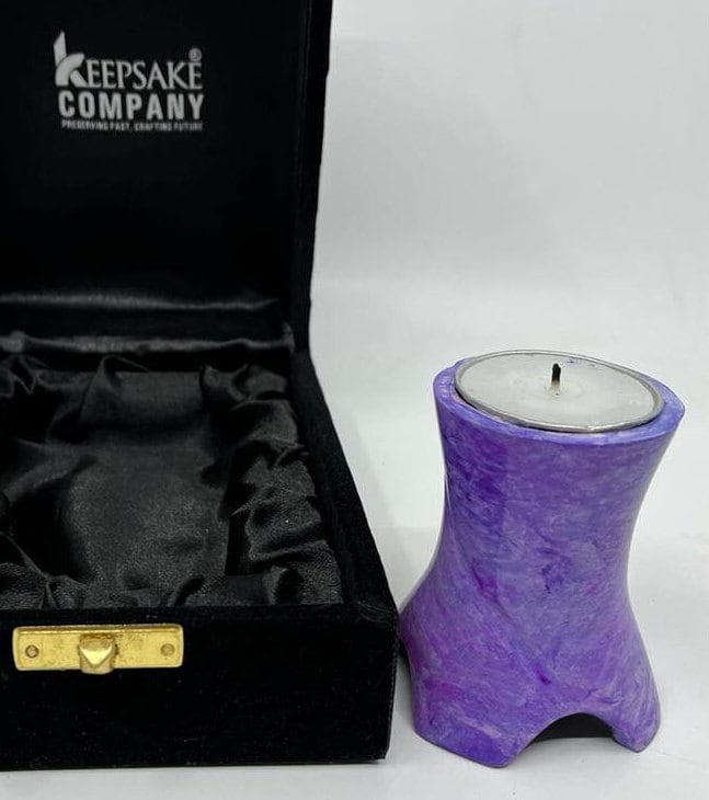 Keepsake Company's Tealight Cremation Urn in shades of lavender color .