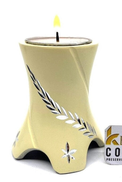 Keepsake Company's Tealight Cremation Urn in gracious pale color and sparkling engraving design