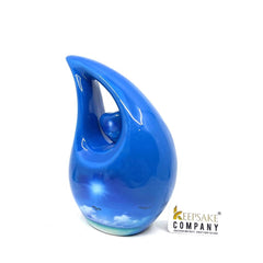 Blue Teardrop Cremation urn on a sunny bright day with  birds going home - Urn- Urns for Ashes - Memorial Urn =  Medim Urn  6 Inches Height