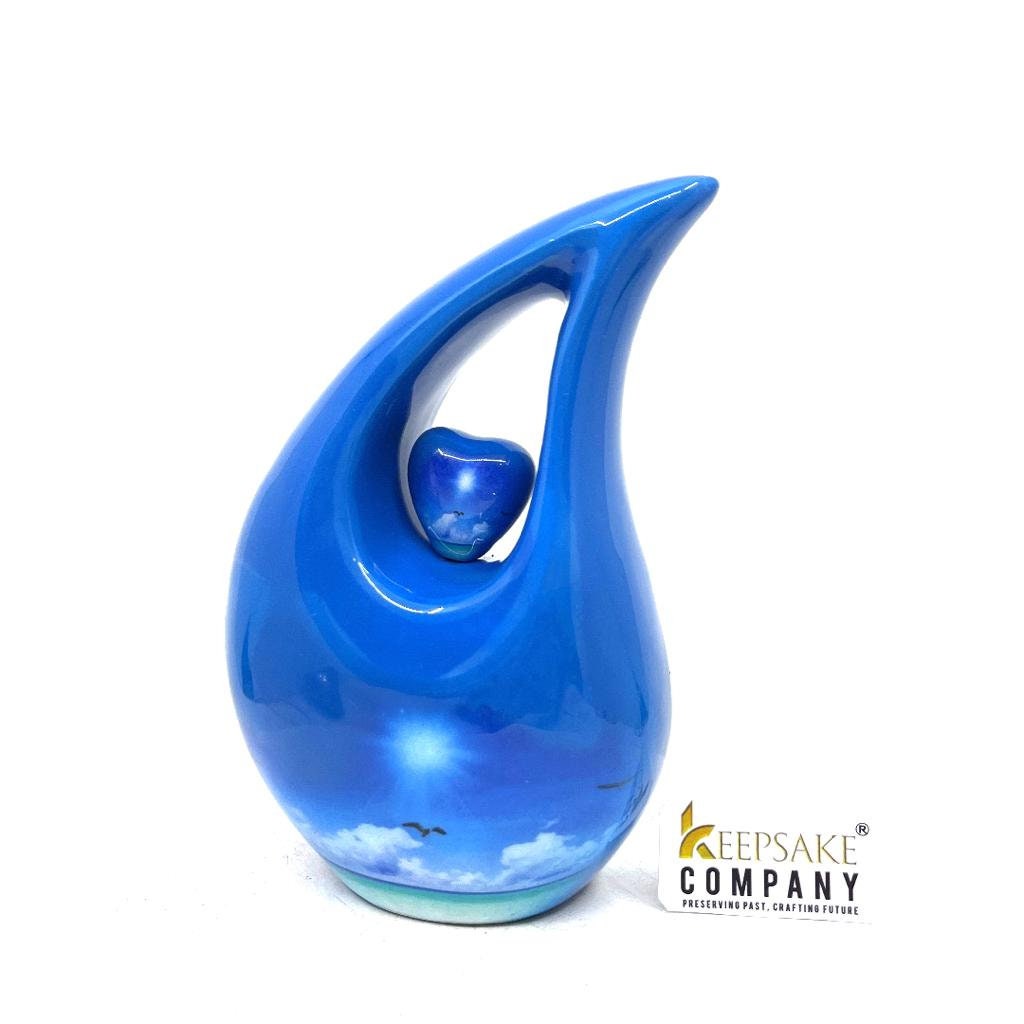 Blue Teardrop Cremation urn on a sunny bright day with  birds going home - Urn- Urns for Ashes - Memorial Urn =  Medim Urn  6 Inches Height