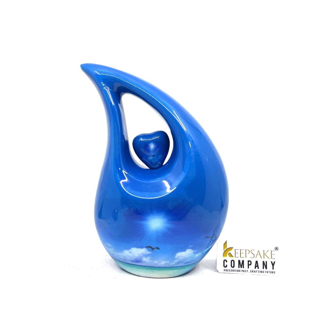 Blue Teardrop Cremation urn on a sunny bright day with  birds going home - Urn- Urns for Ashes - Memorial Urn =  Medim Urn  6 Inches Height